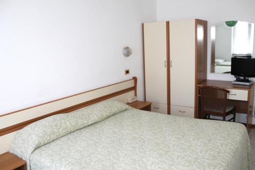 Ένα ή περισσότερα κρεβάτια σε δωμάτιο στο Hotel I 4 Assi