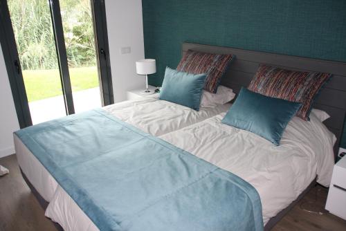 Un pat sau paturi într-o cameră la Na Baía