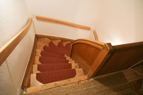an overhead view of a set of stairs in a house at Cafe-Konditorei-Pension Sander in Niederfell