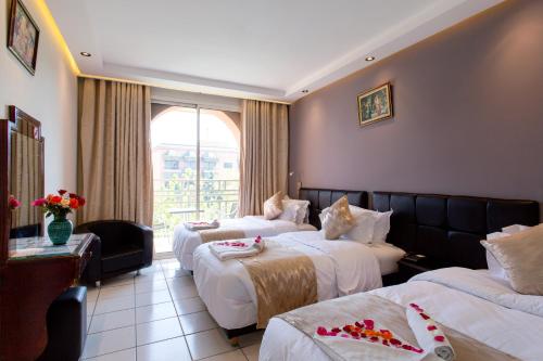 Cama o camas de una habitación en Hotel Akabar