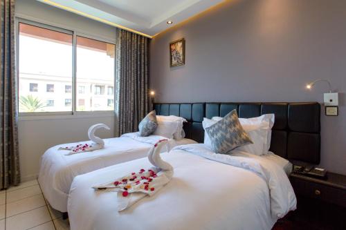Cama o camas de una habitación en Hotel Akabar