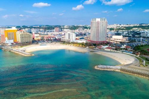 an aerial view of a beach in a city at Ts square in Ginowan