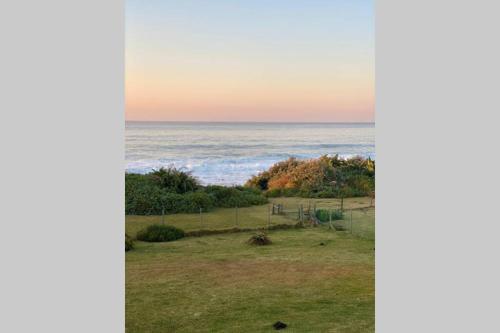 a view of the ocean from a house at Tamassa Holiday Home on the Beach, in Port Edward in Port Edward