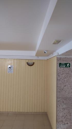 a room with a ceiling with a sign on the wall at Lorena in Salou