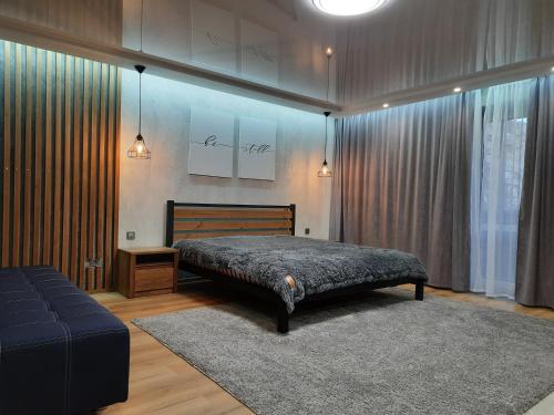 Cama o camas de una habitación en ВИТАЛИЯ МАТУСЕВИЧА ДОМ 4