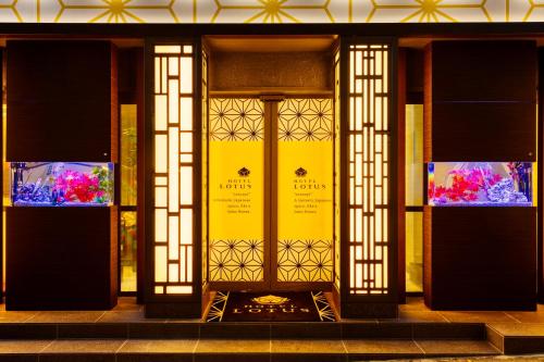 an entrance to a building with a yellow door at HOTEL Lotus Shibuya (Adult Only) in Tokyo