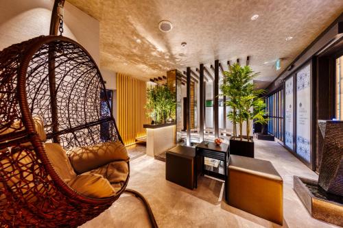 a room with a hanging chair in a building at HOTEL Lotus Shibuya (Adult Only) in Tokyo