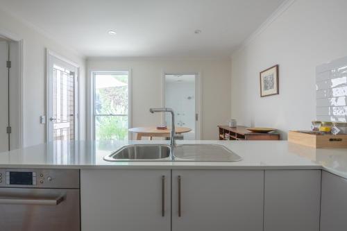 a kitchen with a sink and a counter top at Mark and Kate's Place in Bendigo