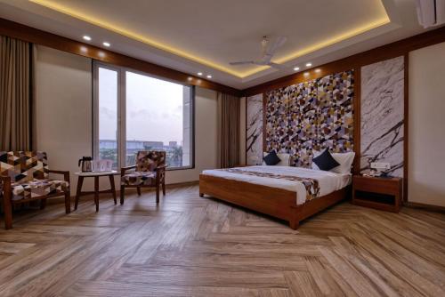Postel nebo postele na pokoji v ubytování HOTEL FLOURISH INTERNATIONAL