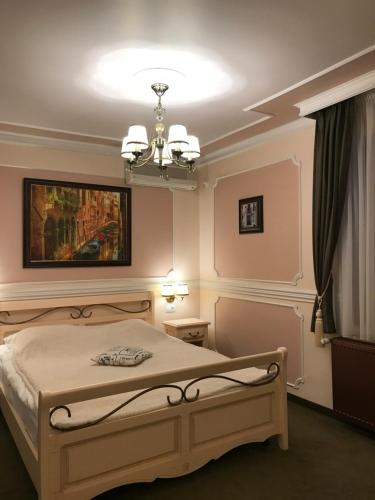 Postel nebo postele na pokoji v ubytování Hotel Parc Tecuci