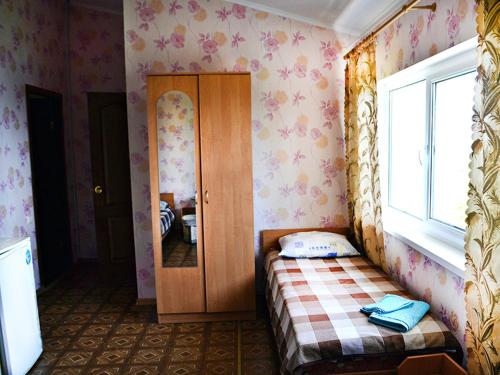 Кровать или кровати в номере Oтель Причал-Приморский