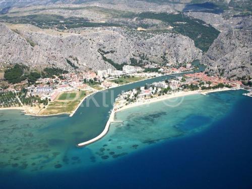 an aerial view of a small island in the water at modern in Duće