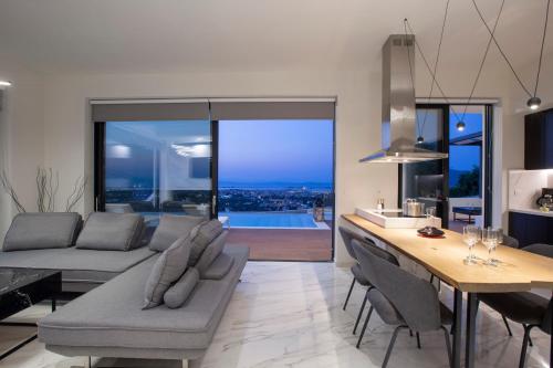 a living room with a couch and a table at ioniangems in Lefkada Town