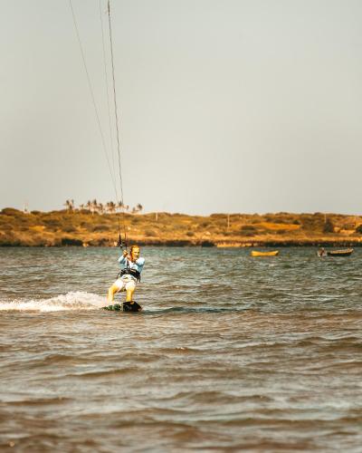 a man is water skiing on a body of water at Che Shale in Mambrui