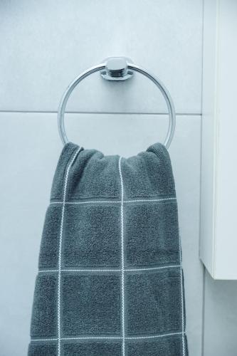 a towel hanging on a towel rack in a bathroom at Greyville Apartments in Lusaka