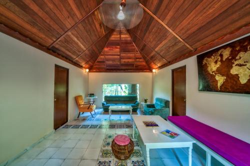 a living room with a couch and a table at Munjoh Ocean Resort in Havelock Island