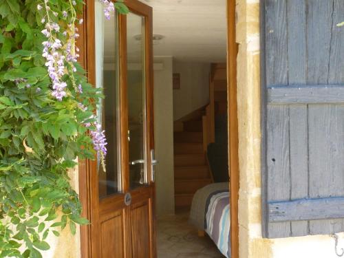 an open door to a room with a stairway at la Bergerie du Bois Joannin 1497 route des fleuriats in Iguerande