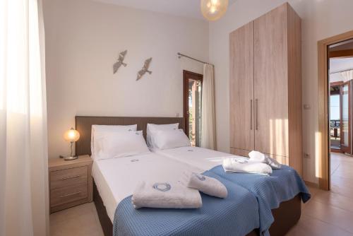 Ένα ή περισσότερα κρεβάτια σε δωμάτιο στο Terra d'Oro Villas