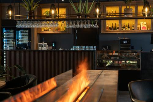a bar with a wooden table in a restaurant at Quality Hotel Ålesund in Ålesund