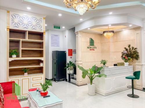 a lobby with a waiting room with plants at NEW CITY HOTEL in Tây Ninh