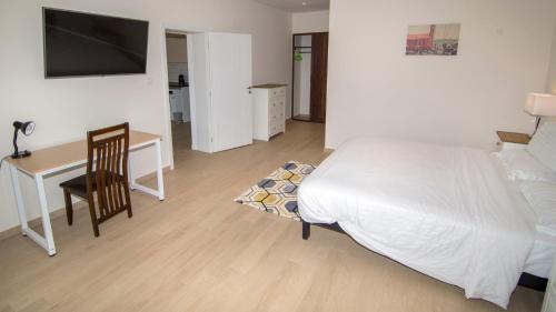 Cama o camas de una habitación en New Brookfields Hotel