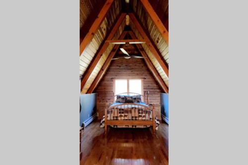 a room with a crib in the attic at 90 acre Indescribable Mountain View Getaway! Hot Tub - Pool Table - Fire Pit - Games! in Shrewsbury