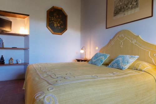 Postel nebo postele na pokoji v ubytování Fattoria Il Milione Agriturismo