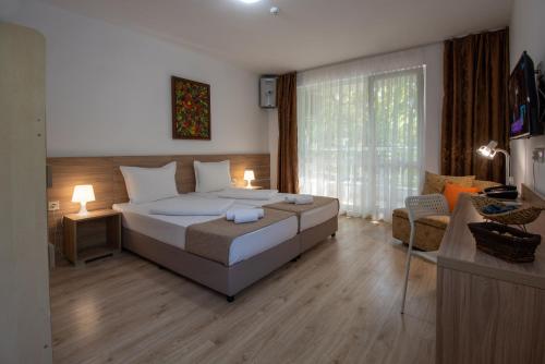 Postel nebo postele na pokoji v ubytování Ariana Hotel
