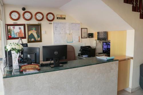 an office with a desk with a computer on it at Al Nile Hotel in Salalah