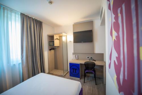 Cama o camas de una habitación en Hotel Omnia