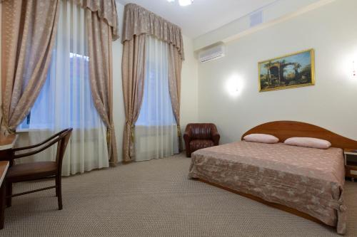 Кровать или кровати в номере Приват Отель