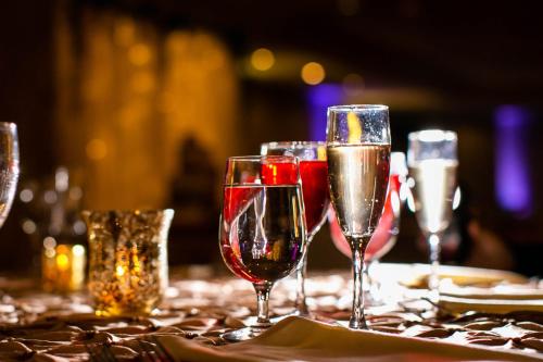 a group of wine glasses sitting on a table at Holiday Inn Manahawkin/Long Beach Island by IHG in Manahawkin