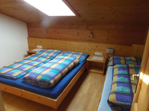 Postel nebo postele na pokoji v ubytování Schattaugut