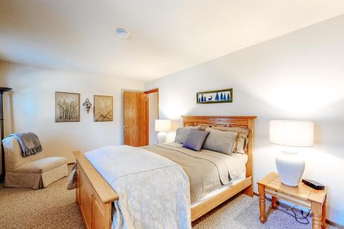 a bedroom with a large bed and a chair at Summer Creek in Groveland