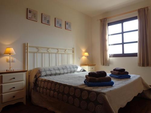 En eller flere senger på et rom på Casa Miel