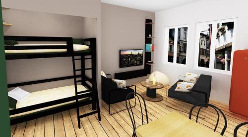 a room with two bunk beds and a living room at LOUHANS Les Petites Arcades avec ses deux appartements coté Arcades et coté cour in Louhans