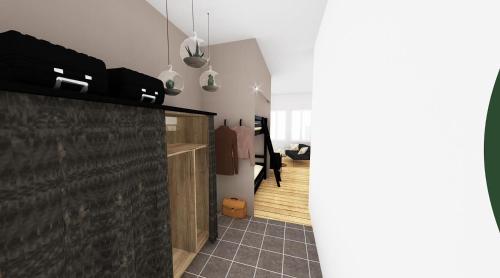 a hallway with a black tiled floor and a room at LOUHANS Les Petites Arcades avec ses deux appartements coté Arcades et coté cour in Louhans