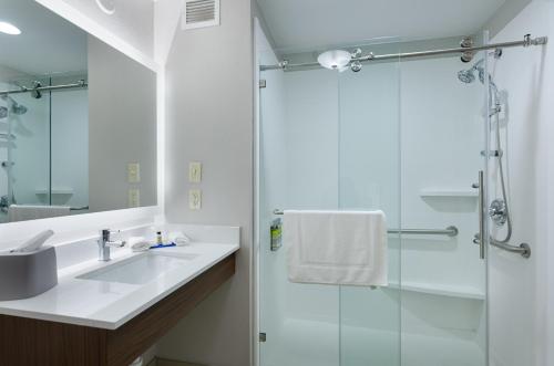 a bathroom with a sink and a shower at Holiday Inn Express Hotel & Suites Weston, an IHG Hotel in Weston
