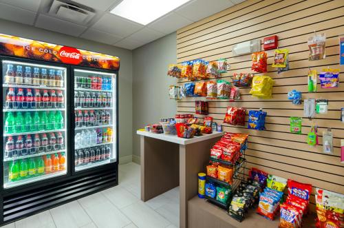 a soda machine in a store with drinks and snacks at Holiday Inn Express Hotel & Suites Weston by IHG in Weston