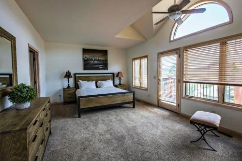 a bedroom with a bed and a ceiling fan at The Stanley Hotel in Estes Park
