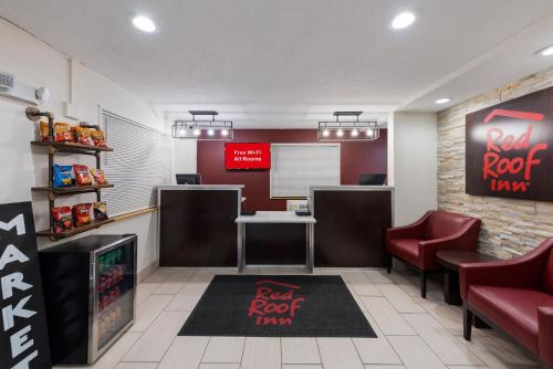 a restaurant with a red root tavern sign on the wall at Red Roof Inn Findlay in Findlay