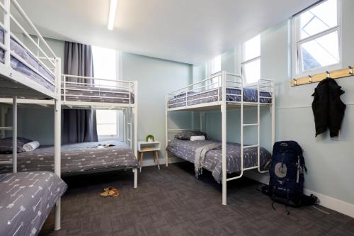 
A bunk bed or bunk beds in a room at Wanderlust NZ
