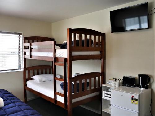 Postel nebo postele na pokoji v ubytování Kaiteri Lodge