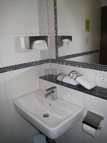 Ett badrum på Gasthaus Pension Donishäusle