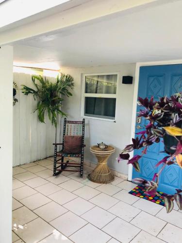 a porch with a chair and a window at Independent Studio in Little Havana in Miami