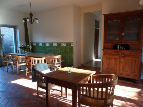 a dining room with wooden tables and chairs at SintAnna B&B PetitHotel in Yerseke