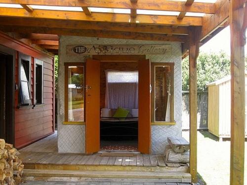 a porch of a house with an open door at The Ski House on Miharo - Rangataua Holiday Home in Ohakune