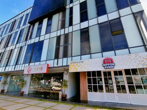 a store front of a building on a street at Bei Boutique Hotel in Muar