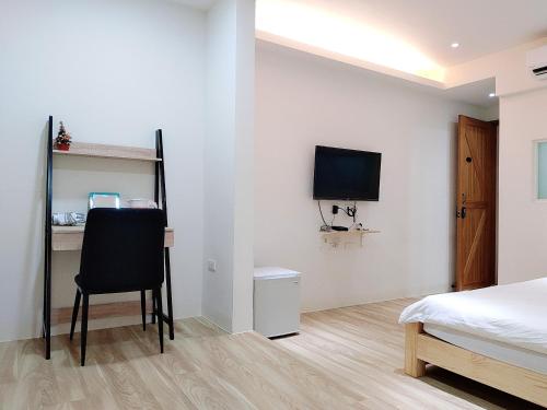 TV a/nebo společenská místnost v ubytování Ji Apartment