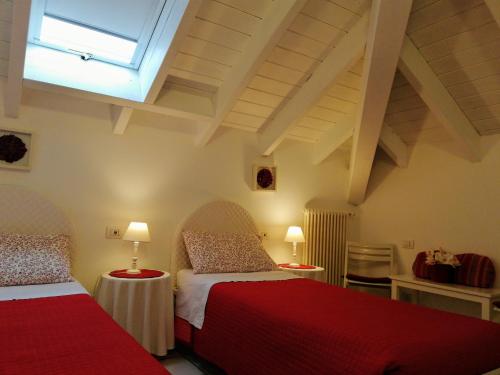 A bed or beds in a room at B&B LE MAGNOLIE